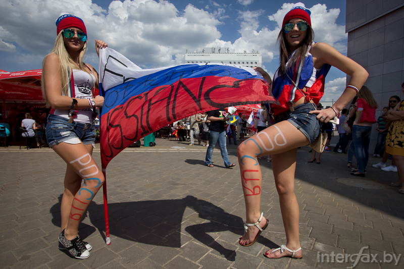 Russian girls are posing with Russian flag